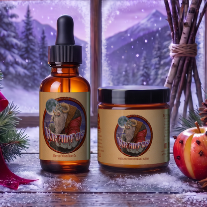 Krampus Beard Oil & Butter Kit with beard oil and beard butter in Evergreen Wreath, Pine Boughs and Spiced Apples scent on a snowy windowsill with pine boughs, cinnamon sticks, a red ribbon and clove-studded apples under a moonlit winter sky, Fable Beard Co.